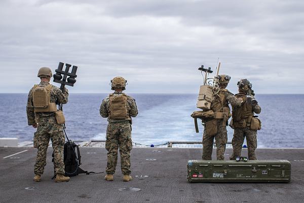 U.S. Marines assigned to Battalion Landing Team 1/5, 15th Marine Expeditionary Unit, and Marine Medium Tiltrotor Squadron (VMM) 165 (Reinforced), 15th MEU, scan for simulated threats from the amphibious assault ship USS Boxer (LHD 4) with a NightFighter S portable counter-unmanned aerial vehicle system, a MODI II system, and an FIM-92 Stinger during a counter-unmanned aircraft system drill in the Pacific Ocean July 20, 2024. Elements of the 15th MEU are currently embarked aboard the Boxer Amphibious Ready Group conducting routine operations in U.S. 3rd Fleet. (U.S. Marine Corps photo by Cpl. Amelia Kang)