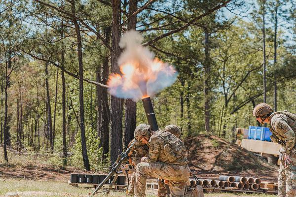 U.S. Army Soldiers assigned to 3rd U.S. Infantry Regiment (The Old Guard) aim and fire a 120mm M120A1 Towed Mortar System during the 2025 International Best Mortar Competition at Fort Benning, Georgia, April 9, 2024. The Best Mortar Competition highlights the capabilities of mortar crews and gives spectators an inside-look at combat operations. (U.S. Army photo by Capt. Stephanie Snyder)