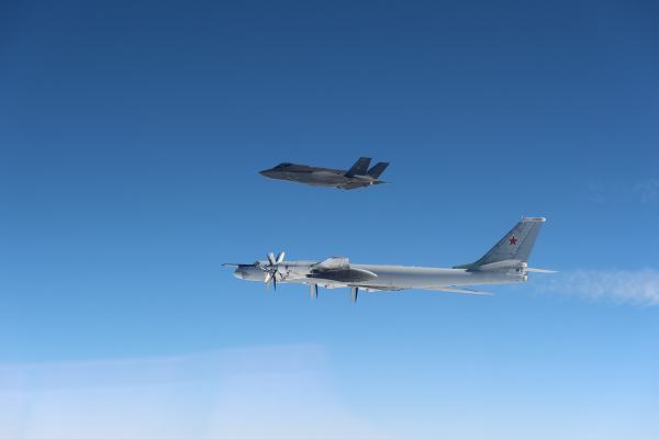 A U.S. Air Force F-35 Lightning II intercepts a Russian Tu-95 “Bear” strategic bomber over the Bering Sea, April 14, 2025. Multiple F-35s were launched to intercept and monitor Russian aircraft, which remained in international airspace roughly 250 nautical miles from Shemya Island in the western Aleutians. NORAD noted that while this type of Russian activity within the Alaskan Air Defense Identification Zone is routine and not viewed as a threat, it is continuously monitored to safeguard the security of North America. (U.S. Department of Defense photo) 