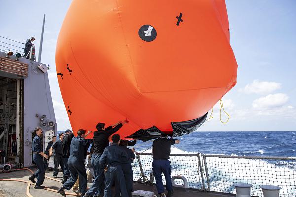 250507-N-NF288-1431 NORTH PACIFIC OCEAN (May 7, 2025) Sailors deploy the killer tomato, a floating target for a live fire exercise aboard Arleigh Burke-class guided-missile destroyer USS Preble (DDG 88) in the North Pacific Ocean, May 7. Preble is forward deployed and assigned to Destroyer Squadron (DESRON) 15, the Navy’s largest DESRON and the U.S. 7th fleet’s principal surface force. (U.S. Navy photo by Mass Communication Specialist 1st Class Jamaal Liddell)