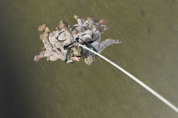 U.S. Marines with 2nd Reconnaissance Battalion (2nd Recon) suspend from a UH-1Y Venom with Marine Light Attack Helicopter Squadron (HMLA) 269 during special patrol insertion and extraction (SPIE) training near Marine Corps Air Station New River, North Carolina, May 8, 2025. HMLA-269 conducted a series of training evolutions with 2nd Recon to improve the squadron’s proficiency in providing assault support to Marine Corps ground units. (U.S. Marine Corps photo by Lance Cpl. Mya Seymour)