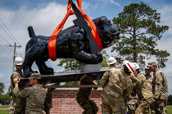 Soldiers with the 92nd Engineer Battalion, 3rd Infantry Division Artillery, 3rd Infantry Division, install a support frame onto a new Rocky the Bulldog statue at Warriors Walk at Fort Stewart, Georgia, May 28, 2025. The 92nd Engineer Battalion “The Black Diamonds” remain ready to deploy at a moment’s notice, delivering a wide range of engineer capabilities, such as construction, mobility support, and infrastructure development, to warfighters both in the continental United States and overseas. (U.S. Army photo by Spc. Luciano Alcala)