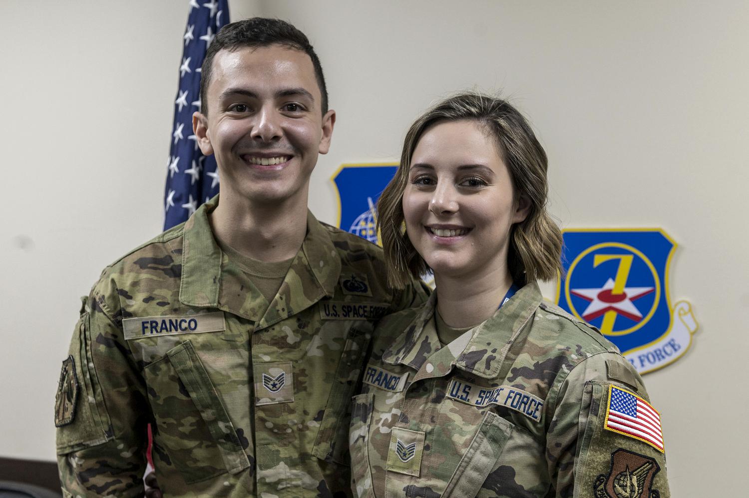 Space Force Sgts. Frank and Jamie Franco pose for a photo following a transfer ceremony at Osan Air Base, South Korea, Feb. 5, 2021. The Francos, who volunteered to switch services, were among the 5,000 initial airmen selected to help set the foundation for the Space Force. (Photo By: Staff Sgt. Betty R. Chevalier)