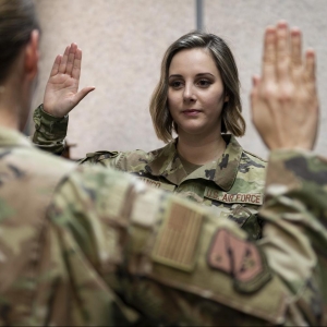 Air Force Staff Sgt. Jamie Franco recites the oath of enlistment during a change of service ceremony at Osan Air Base, South Korea, Feb. 1, 2021. Jamie and her husband, Frank, both made the jump from the Air Force to the Space Force. (Photo By: Staff Sgt. Betty Chevalier)