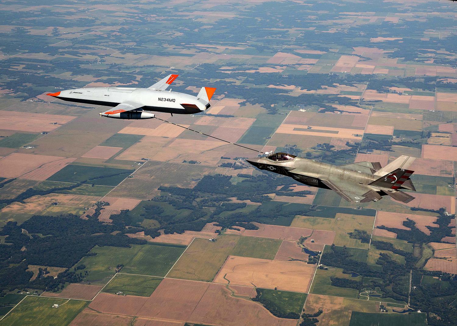 MASCOUTAH, Ill. (Sept. 13, 2021) An unmanned Boeing MQ-25 T1 Stingray test aircraft, left, refuels a manned F-35 Lightning II, Sept. 13, 2021, near MidAmerica Airport in Mascoutah, Illinois. This successful flight demonstrated that the MQ-25 Stingray can fulfill its tanker mission using the Navy's standard probe-and-drogue aerial refueling method. Testing with the unmanned MQ-25 T1 Stingray will continue over the next several months. The MQ-25A Stingray will be the world's first operational carrier-based unmanned aircraft and provide critical aerial refueling and intelligence, surveillance and reconnaissance capabilities that greatly expand the global reach, operational flexibility and lethality of the carrier air wing and carrier strike group. (U.S. Navy photo courtesy of Boeing)