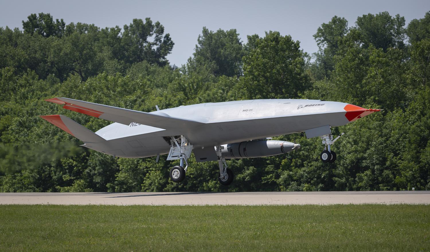 MASCOUTAH, Ill. (June 4, 2021) An unmanned Boeing MQ-25 T1 Stingray test aircraft takes off from MidAmerica Airport in Mascoutah, Illinois to conduct an aerial refueling test with a manned F/A-18 Super Hornet, June 4, 2021. This successful flight demonstrated that the MQ-25 Stingray can fulfill its tanker mission using the Navy's standard probe-and-drogue aerial refueling method. Testing with the unmanned MQ-25 T1 Stingray will continue over the next several months. The MQ-25A Stingray will be the world's first operational carrier-based unmanned aircraft and provide critical aerial refueling and intelligence, surveillance and reconnaissance capabilities that greatly expand the global reach, operational flexibility and lethality of the carrier air wing and carrier strike group. (U.S. Navy photo courtesy of Boeing)