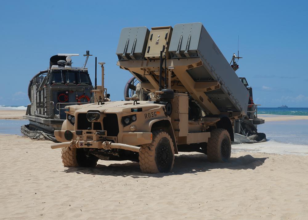 KEKAHA, Hawaii (Aug. 16, 2021) A Navy Marine Expeditionary Ship Interdiction System (NMESIS) launcher deploys into position onboard Pacific Missile Range Facility Barking Sands. The NMESIS and its Naval Strike Missiles participated in a live-fire exercise as part of Large Scale Exercise (LSE) 2021. During the training, a Marine Corps fires expeditionary advanced base (EAB) sensed, located, identified and struck a target ship at sea, which required more than 100 nautical miles of missile flight. The fires EAB Marines developed a targeting solution for a joint force of seapower and airpower which struck the ship as the Marines displaced to a new firing position. The Marine Corps EAB Operations concept is a core component of the Force Design 2030 modernization effort. Photo by Major Nick Mannweiler.