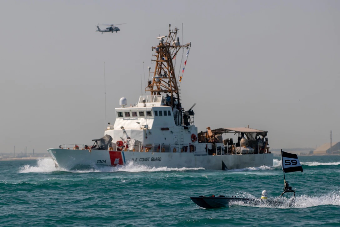 A MANTAS T-12 unmanned surface vessel (USV), front, operates alongside U.S. Coast Guard patrol boat USCGC Maui (WPB 1304) during exercise New Horizon in the Arabian Gulf, Oct. 26. Exercise New Horizon was U.S. Naval Forces Central Command Task Force 59’s first at-sea evolution since its establishment Sept. 9. Photo by Petty Officer 3rd Class Dawson Roth.