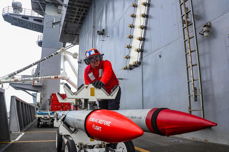 210708-N-NF912-1377PACIFIC OCEAN (July 8, 2021) Airman Daniel Norrin, from Colorado Springs, Colo., transports ordnance on the flight deck of the aircraft carrier USS Abraham Lincoln (CVN 72). Abraham Lincoln is underway conducting routine operations in the U.S. 3rd Fleet area of operations. (U.S. Navy photo by Mass Communication Specialist 3rd Class Jeremiah Bartelt/Released)