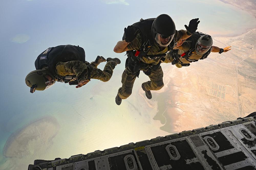 Airmen perform a high altitude, low opening jump from an Air Force C-130J Super Hercules over East Africa, Sept. 2, 2021.  Photo by Air Force Tech. Sgt. Michael Cossaboom.