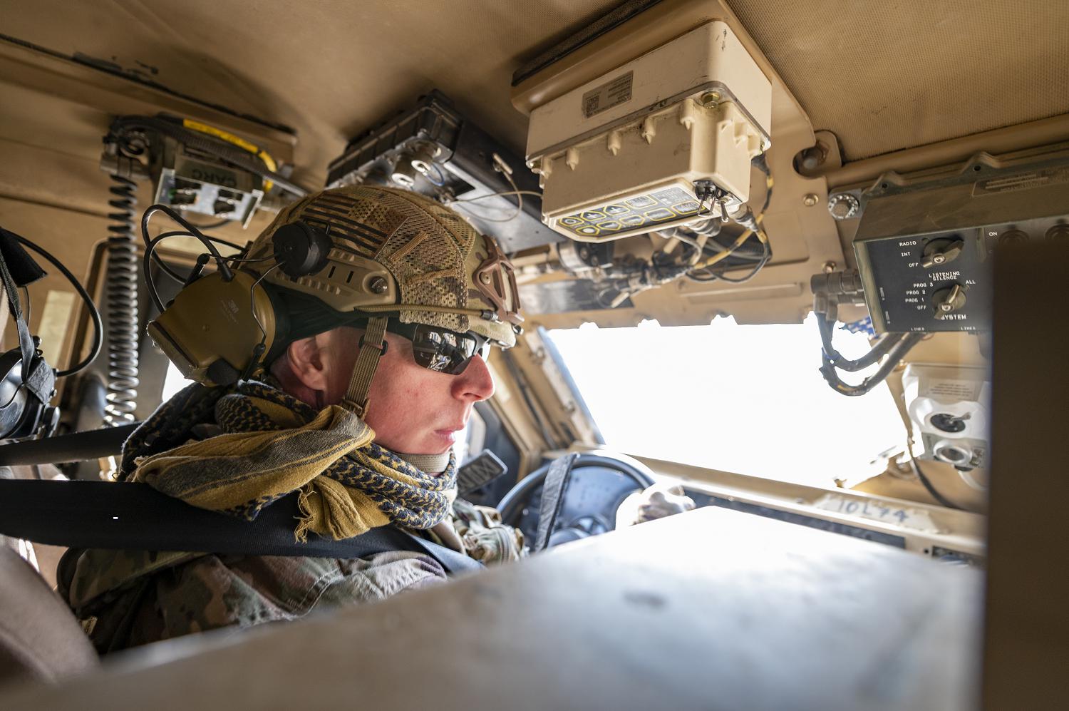 U.S. Air Force Tech. Sgt. William Mack, 332nd Expeditionary Security Forces Squadron alpha first sergeant, patrols the base in an M-ATV Nov. 24, 2021, at an undisclosed location somewhere in Southwest Asia. The 332nd ESFS provides force protection, ensuring operational readiness and protecting warfighting resources as well as its personnel. (U.S. Air Force photo by Senior Airman Karla Parra)