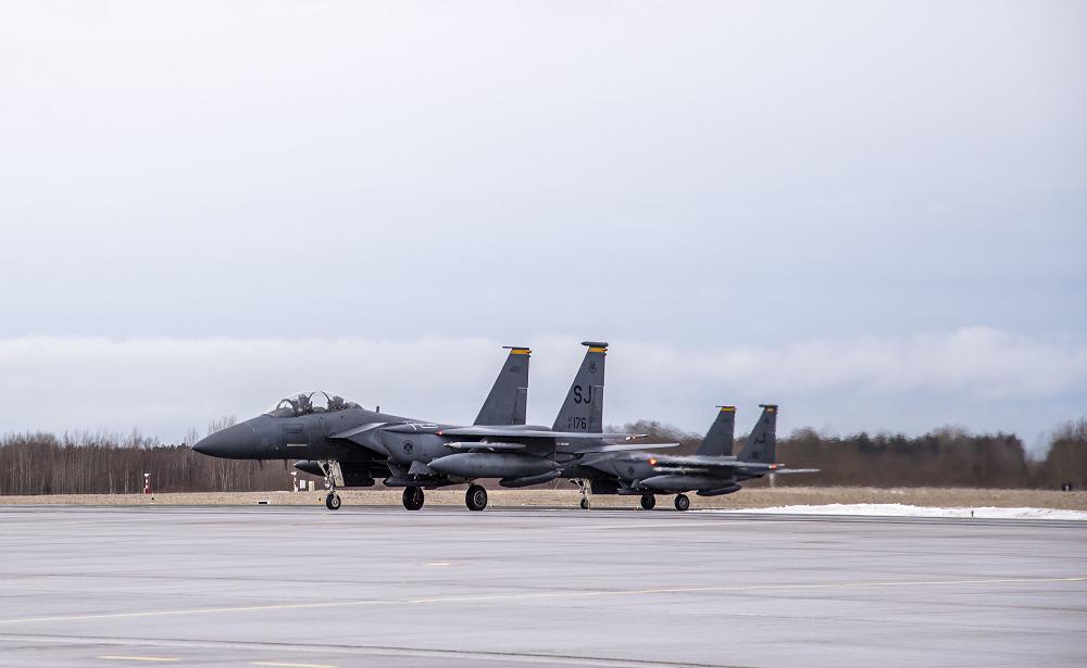 Two F-15E Strike Eagles, assigned to the 4th Fighter Wing from Seymour Johnson Air Force Base in N.C., are parked at Ämari Air Base, Estonia, Jan. 26, 2022. The F-15E Strike Eagles, along with Belgian F-16s, are deployed to Ämari Air Base in support of a NATO enhanced Air Policing mission. NATO’s enhanced Air Policing missions demonstrate solidarity, collective resolve and its ability to adapt and scale its defensive missions and deterrence posture in response to the evolving security situation facing the alliance. (U.S. Air Force photo by Staff Sgt. Megan Beatty)
