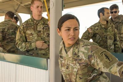 Army Sgt. Angel Durkee, an intelligence analyst assigned to the 10th Special Forces Group, practices leaning outside of a simulated aircraft door, May 19, 2017, during a static-line jumpmaster course at Fort Carson, Colo. Army photo by Staff Sgt. William Reinier