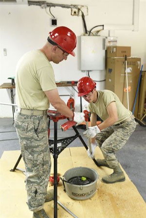 Meet Your Military father and son deploy to slovenia Air Force Airman 1st Class Austin Furr and his father, Chief Master Sgt. Brian Furr, manually thread pipe while preparing for exercise Immediate Response in Postonja, Slovenia, June 14, 2017. This was Austin's first deployment. The Furrs are assigned to the Montana Air National Guard's 219th Rapid Engineer Deployable Heavy Operational Repair Squadron Engineer. Montana Air National Guard photo by Staff Sgt. Lindsey Soulsby 