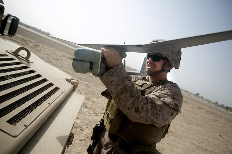 Marine Corps Sgt. John Verhage III, a native of South Brunswick, N.J., aids in the employment of remote sensor systems and unmanned aerial surveillance assets to help detect the movement of enemy personnel and vehicles prior to a sensor emplacement mission near Bost Airfield, Afghanistan, March 10, 2018. He is a surveillance sensor operator with Task Force Southwest. Marine Corps photo by Sgt. Sean J. Berry