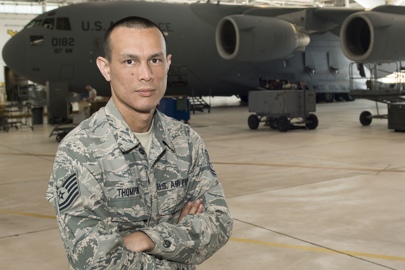Air Force Tech. Sgt. Michael Thompson, an electronic systems mechanic serving with the West Virginia Air National Guard’s 167th Airlift Wing poses for a photo in Martinsburg, W.Va., May 3, 2018. A Vietnam veteran helped Thompson’s family and inspired him to join the military. Air Force photo by Senior Master Sgt. Emily Beightol-Deyerle