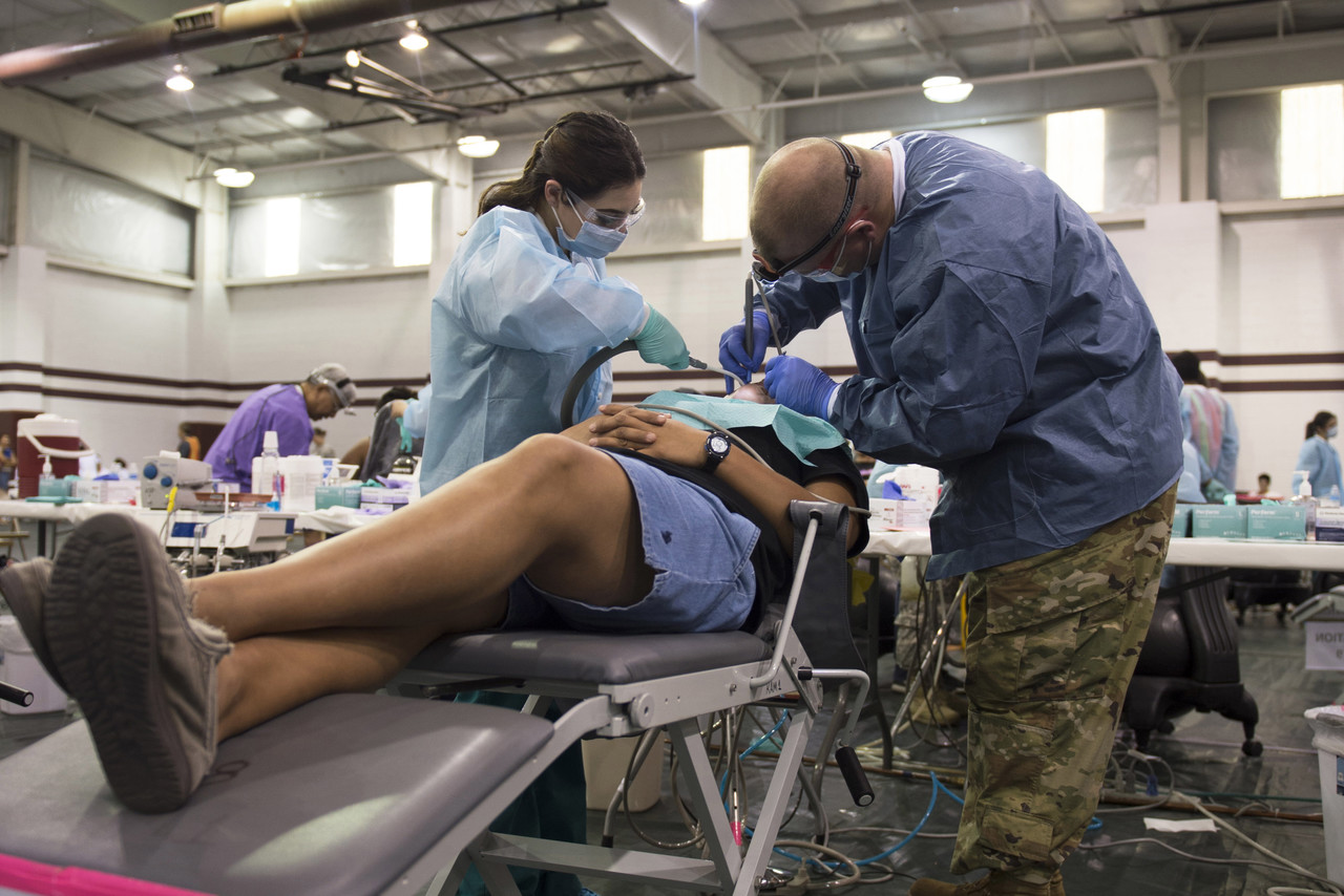 Army Reservists and National Guardsmen dentists and dental assistants work alongside a U.S. Public Health Service personnel in Pharr, Texas during a free dental clinic as part of Operation Lone Star, an annual medical disaster preparedness exercise, July 27, 2016. Photo By: Texas Army National Guard Sgt. 1st Class Malcolm McClendon