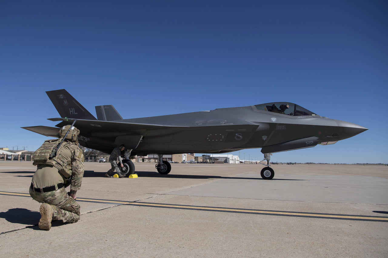 A special tactics airman with the 26th Special Tactics Squadron looks onto an F-35A Lightning II fighter aircraft at Cannon Air Force Base, N.M., Feb. 26, 2019.  Photo By: Air Force Staff Sgt. Rose Gudex