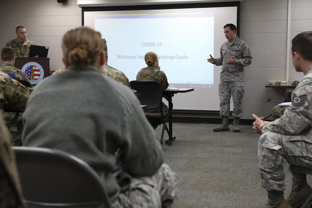 Master Sgt. Steven Ulrich instructs Wisconsin National Guard Soldiers and Airmen on mortuary affairs support in Whitewater, Wisconsin, April 8, 2020. Approximately 20 members of the Wisconsin National Guard Soldiers were trained to assist civilian mortuaries in response to COVID-19. (Photo by Spc. Anya Hanson)