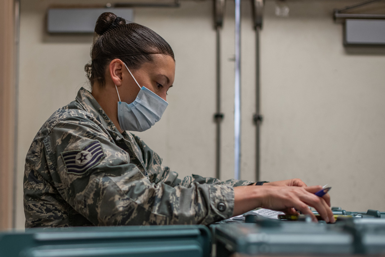 Tech. Sgt. Daysha Norwood, a general manager of the Pecos Trail Dining Facility assigned to the 27th Special Operations Force Support Squadron, goes over checklists to ensure the correct amount of meals were prepared for delivery to quarantined Airmen at the Pecos Trail DFAC on Cannon Air Force Base, N.M., May 15, 2020. The 27 SOFSS has prepared over 2,500 meals for Airmen quarantined to the base since the beginning of May. (U.S. Air Force photo by Senior Airman Maxwell Daigle)