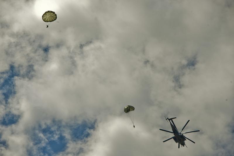 JOINT BASE MCGUIRE-DIX-LAKEHURST, N.J. – Paratroopers with 404th Civil Affairs Battalion, United States Civil Affairs & Psychological Operations Command (Airborne), jump out of a Sikorsky CH-53 Sea Stallion Helicopter during a large scale airborne operation here on Aug. 14, 2020. The unit conducted non-tactical airborne operations in order to maintain mission readiness and proficiency among their paratroopers.(U.S. Army Photo By: Sgt. 1st Class Gregory Williams, 361st Theater Public Affairs Support Element/Released)