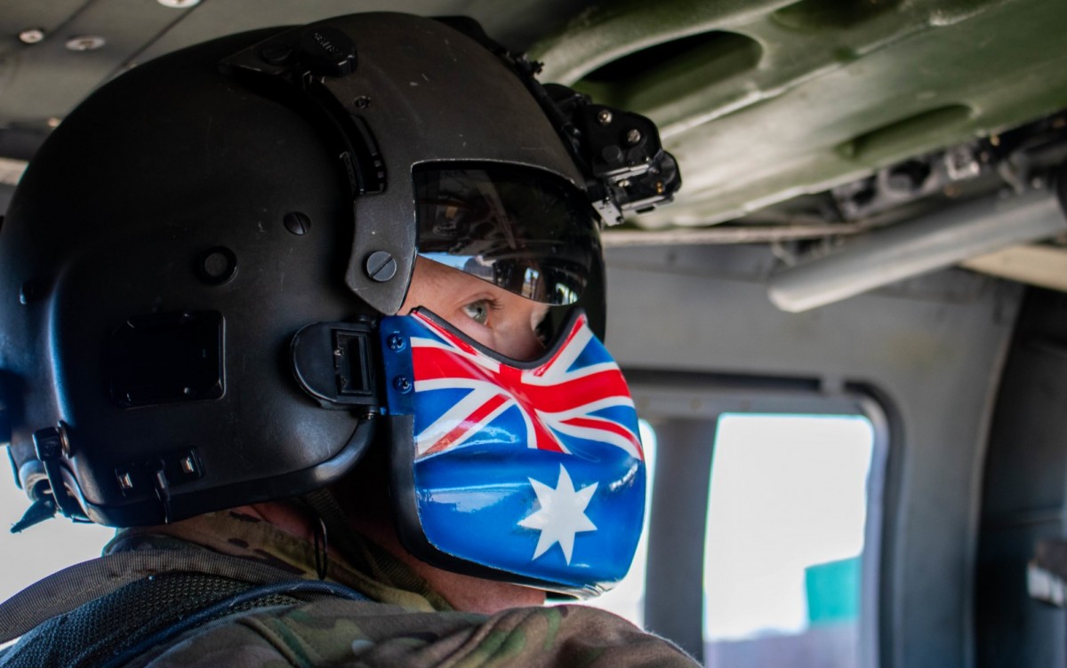 Sgt. Abraham Boxx, a critical care flight paramedic with the 1st Battalion, 168th General Support Aviation Battalion, Washington Army National Guard, rides in a UH-60 Black Hawk during a medical evacuation drill at Camp Bondsteel, Kosovo on Jan. 2, 2021. Boxx moved to the U.S. from Australia to become certified as a flight paramedic in 2016 and later joined the Washington Army National Guard.