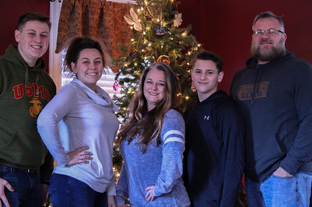 Former U.S. Marine Larry Shanes poses for a family photo in the family home in North Carolina, Dec. 28, 2020. The Shanes family enjoyed a few last minute holiday festivities before sending daughter, A1C Chloe Shanes, back to Joint Base Langley-Eustis. (Left to right: Nathan Shanes, Chloe Shanes, Amy Shanes, Cooper Shanes, and Larry Shanes). (Courtesy Photo)