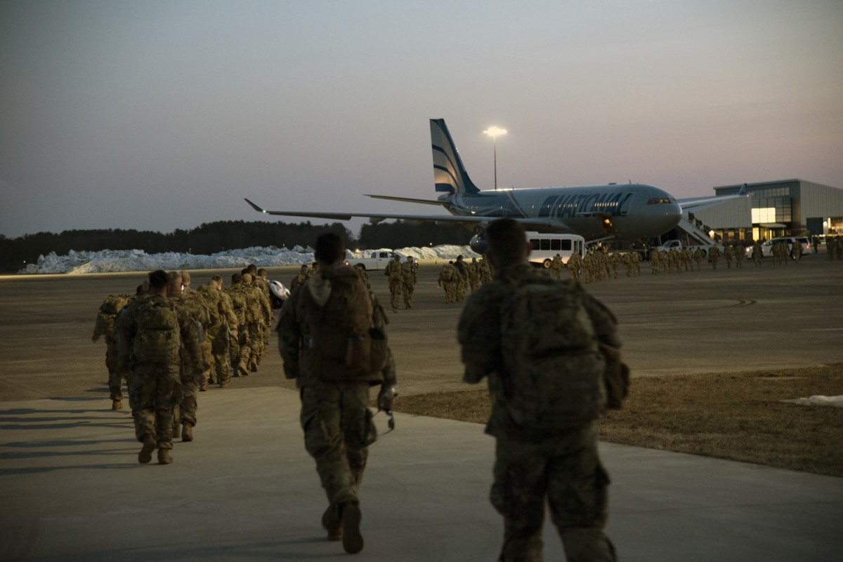 U.S. Soldiers of the 1st Battalion, 102nd Infantry Regiment and H Company, 186th Brigade Support Battalion, leave for Fort Bliss, Texas, on March 10, 2021. At Fort Bliss, Soldiers will conduct mobilization training in preparation for their mission in Africa in support of Combined Joint Task Force, Horn of Africa. (Staff Sgt. Katie Grandori)