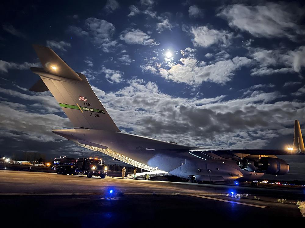 U.S. Air Force Airmen with the 62nd Airlift Wing and 627th Logistics Readiness Squadron perform a wet-wing defuel procedure on a C-17 Globemaster III as part of Exercise Rainier War at Joint Base Lewis-McChord, Washington, April 27, 2021. Rainier War tests the 62nd Airlift Wing's capability to plan, generate and execute a deployment tasking, sustain contingency operations, demonstrate full spectrum readiness while executing agile combat employment in a contested, degraded and operationally limited environment. (photo by Master Sgt. Julius Delos Reyes)