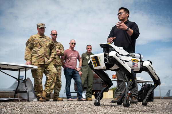 An Asylon representative leads a robotic dog capabilities demonstration during the first Synchronized Nuclear Readiness Operations Training at MacDill Air Force Base, Fla., March 6, 2024. The demonstration showcased emerging technology in remotely operated security systems. The robotic dog allows for immediate response in emergency situations without endangering the life of defenders. (U.S. Air Force photo by Senior Airman Zachary Foster) 