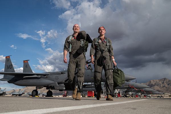 Maj. Nathan Persons and Capt. Annie Braun, weapon systems officers assigned to the 366th Fighter Wing, Mountain Home Air Force Base, Idaho, depart an F-15E Strike Eagle after finishing an exercise Red Flag-Nellis 24-2 mission at Nellis AFB, Nev., March 18, 2024. Red Flag exercises provide aircrews the experience of multiple, intensive air combat sorties in the safety of a training environment. (U.S. Air Force photo by William R. Lewis) 