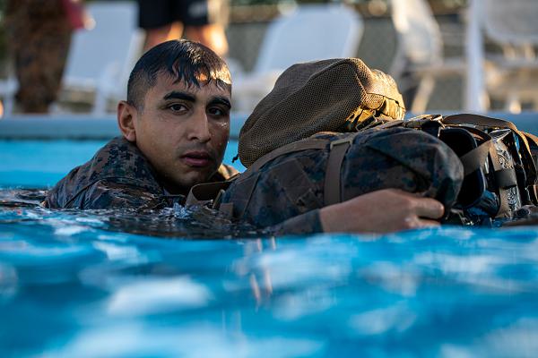 Lance Cpl. Anthony Silva, a basic infantry Marine with 3rd Force Reconnaissance Training Platoon, 4th Marine Division, participates in a water survival screening at Camp Shelby, Miss., on July 19, 2020. This training will ultimately prepare them for lengthy and difficult amphibious missions in any clime and place. Marines with Marine Forces Reserve continue to safely train through the ongoing pandemic to remain ready to go, fight, and win at a moment's notice. (U.S. Marine Corps photo by Cpl. JVonnta Taylor)