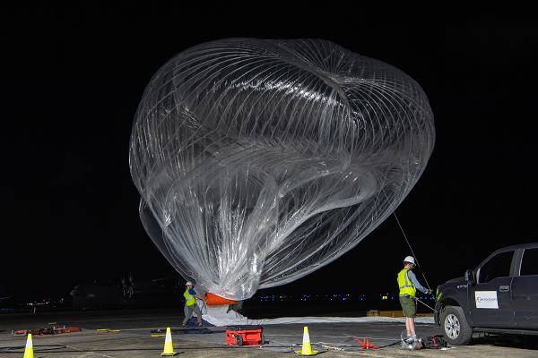 Aerostar flight operations team members prepare to launch a high-altitude balloon (HAB) in support of Valiant Shield 2024 at Antonio B. Won Pat International Airport, Guam, June 10, 2024. HABs provide the U.S. military with long endurance and persistent air-based capabilities that serve as a platform for different payloads such as sensors, communication relays, and weather monitoring systems. Exercises such as Valiant Shield allow the Indo-Pacific Command Joint Forces the opportunity to integrate forces from all branches of service and with allies to conduct precise, lethal, and overwhelming multi-axis, multi-domain effects that demonstrate the strength and versatility of the Joint Force and its commitment to a free and open Indo-Pacific. (U.S. Air Force photo by Senior Airman Natalie Doan)