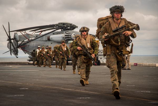BALTIC SEA (June 19, 2024) Marines with the 24th Marine Expeditionary Unit (MEU), Special Operations Capable (SOC) transit the flight deck of the San Antonio-class amphibious transport dock ship USS New York (LPD 21) during the exercise Baltic Operations 24 (BALTOPS 24), June 19, 2024. New York is underway in the Baltic Sea in support of BALTOPS 24 as part of the Wasp Amphibious Ready Group (WSP ARG)-24th MEU (SOC). BALTOPS 24 is the premier maritime-focused exercise in the Baltic Region. The exercise, led by U.S. Naval Forces Europe-Africa and executed by Naval Striking and Support Forces NATO, provides a unique training opportunity to strengthen combined response capabilities critical to preserving freedom of navigation and security in the Baltic Sea.  (U.S. Navy photo by Mass Communication Specialist 2nd Class Jesse Turner)