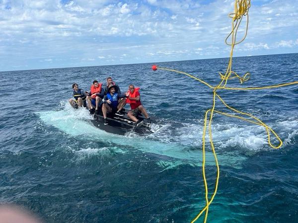A Coast Guard Station Mayport boat crew rescues five people after their 24-foot vessel capsized 11 miles offshore of Mayport, Florida, July 7, 2024. The boat crew transported the men to Mayport Boat Ramp to awaiting family members. (U.S. Coast Guard photo, courtesy Station Mayport)