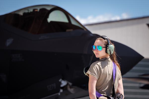 Senior Airman Alexandra Banke, a crew chief with the 158th Fighter Wing, Vermont Air National Guard, prepares to taxi an F-35A Lightning II in South Burlington, Vt., July 1, 2024. The VTANG flew in support of Vermont's Canadian neighbors to the north during their annual Canada Day celebrations. (U.S. Air National Guard photo by Tech. Sgt. Richard Mekkri) 