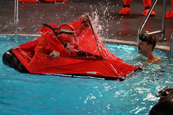 U.S. Naval Submarine School students are put through surface survival training at the school’s Pressurized Submarine Escape Training facility as part of Basic Enlisted Submarine School, July 17, 2024. This training teaches the students what to expect on the surface of a body of water in the need of an emergency submarine escape. U.S. Navy photo by Lauren Laughlin