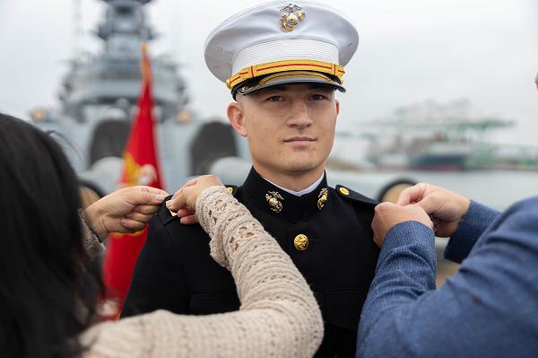 U.S. Marine Corps candidate Joshua McConnell gets pinned to the rank of second lieutenant during a commissioning ceremony at the USS Iowa in Los Angeles, July 7, 2024. A commissioning ceremony is the culminating event for an officer’s career, signifying the transformation from candidate to officer. Battleship USS Iowa served in World War II, Korea, and the Cold War. Today, the historic U.S. Navy ship is an iconic Los Angeles landmark and naval museum. (U.S. Marine Corps photo by Cpl. Fred Garcia)