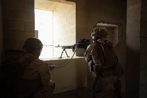 U.S. Marine Corps Pfc. Ardeth Maldonado (left), a rifleman, and Lance Cpl. Brecken Wilcoxen, a team leader, with 2nd Battalion, 4th Marine Regiment, 1st Marine Division, act as the opposing force of a raid during a raid leaders course hosted by Expeditionary Operations Training Group, I Marine Expeditionary Force at Marine Corps Base Camp Pendleton, California, July 11, 2024. The Amphibious Raids Branch of EOTG conducted the RLC to train 2nd Battalion, 4th Marines small-unit leaders in raid fundamentals and in preparation for their upcoming deployment with the 31st Marine Expeditionary Unit. (U.S. Marine Corps photo by Cpl. Brian Knowles)