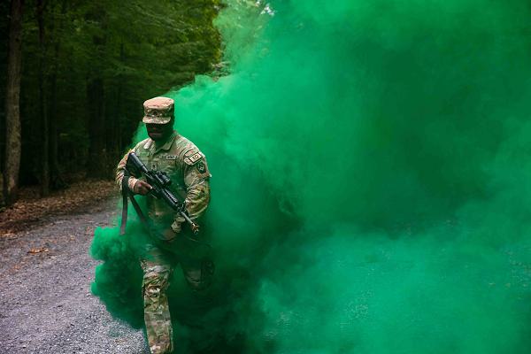 U.S. Army Staff Sgt. Brandon Danner, assigned to the 213th Personnel Company, 728th Combat Sustainment Support Battalion, 213th Regional Support Group, advances toward an opposing force through concealment after taking contact during an Improvised Explosive Device awareness exercise at Fort Indiantown Gap, Pennsylvania, July 24, 2024. Soldiers navigated through a training lane in a convoy, identifying and reacting to IEDs and responding to small arms fire from hostiles. (U.S. Army National Guard photo by Sgt. 1st Class Brandon Nelson)