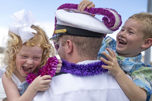 240802-N-EI510-2037 Joint Base Pearl Harbor-Hickam, Hawaii, Aug. 2, 2024.  Lt. Killian Monley, weapons officer for the Los Angeles-class fast-attack submarine USS Charlotte (SSN 766), greets his family on Joint Base Pearl Harbor-Hickam, Hawaii, after returning from a scheduled deployment, Aug. 2, 2024. Charlotte can support various missions, including anti-submarine warfare, anti-surface ship warfare, strike warfare, intelligence, surveillance, and reconnaissance. (U.S. Navy photo by Mass Communication Specialist 1st Class Scott Barnes)