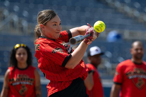 Marine Corps Staff Sgt. Bailey Stiwinter hits the ball during the  home run derby competition at the start of the 2024 Armed Forces Men’s and Women’s Softball Championship hosted by USA Softball at the USA Softball National Hall of Fame Complex in Oklahoma City Aug 13, 2024. The 2024 Armed Forces Men’s and Women’s Softball Championship hosted by USA Softball at the USA Softball National Hall of Fame Complex from 13-19 August features Service members from the Army, Marine Corps, Navy, Air Force (with Space Force personnel) and Coast Guard.  Teams will battle it out for gold. (DoD photo by EJ Hersom)