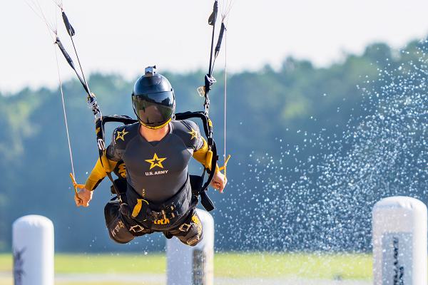 Staff Sgt. Mark Pierce of the U.S. Army Parachute Team conducts an advanced canopy maneuver as part of the United States Parachute Association Canopy Piloting competition on 1 September 2024.  The parachute jump was one of several rounds conducted during the competition on 1-2 September in Raeford, N.C. (U.S. Army photo by Megan Hackett)