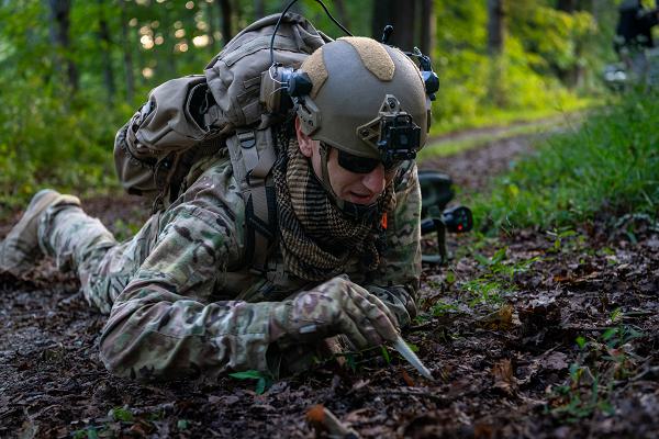 Tech. Sgt. Clay Gorham, an explosive ordnance disposal technician from the 355th Civil Engineer Squadron Contingency, Exercise and Deployment, inspects a suspicious area for improvised explosive devices during an Air Force EOD competition at Muscatatuck Urban Training Center, Ind., Sept. 9, 2024. The event features a series of challenging scenarios designed to replicate real-world environments, pushing participants to demonstrate their skills under realistic and demanding conditions. (U.S. Air Force photo by Jason Wilkinson) 
