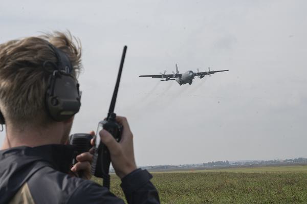 U.S. Air Force Staff Sgt. Brayden Crabtree, 86th Operations Support Squadron complex watch supervisor, communicates with an incoming Polish C-130H Hercules at Leszno Airfield, Poland, during Aviation Rotation Detachment 24-4, Sept. 16, 2024. Bilateral training exercises like ADR provide opportunities to practice information sharing and communication in simulated scenarios, helping to improve interoperability and strengthen trust among allies. (U.S. Air Force Photo by Airman 1st Class Trevor Calvert)