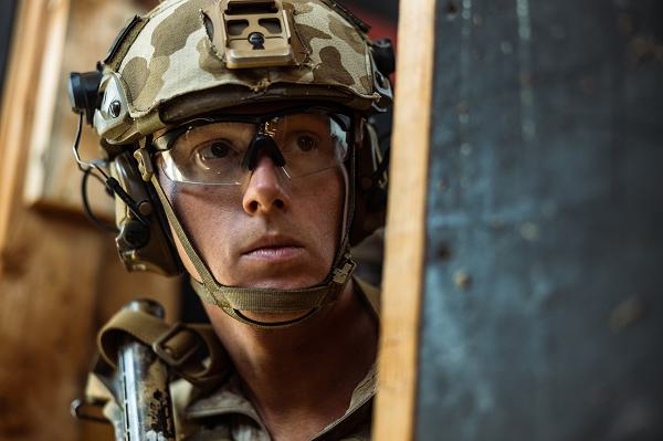 U.S. Marine Corps Sgt. Trent Hau, a mortarman with 1st Battalion, 7th Marine Regiment, 1st Marine Division, assesses his surroundings prior to conducting room clearing techniques during a raid leaders course held by the Amphibious Raids Branch, Expeditionary Operations Training Group, I Marine Expeditionary Force, at Marine Corps Base Camp Pendleton, California, Oct. 5, 2024. The Amphibious Raids Branch of EOTG provides relevant and realistic training to Marines and small-unit leaders in mission-essential tasks, including amphibious raid fundamentals, to prepare units for deployment. (U.S. Marine Corps photo by Lance Cpl. Jordan Searls)