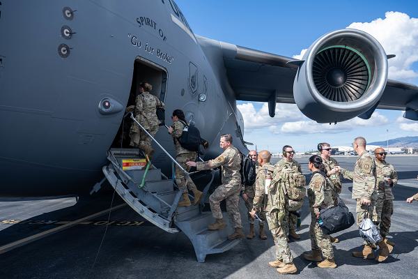 U.S. Air Force Major Command command chiefs, Numbered Air Force command chiefs and other key Senior Enlisted Leaders board a C-17 Globemaster III on Joint Base Pearl Harbor-Hickam, Hawaii, for SEL Mission Command Training, Oct. 22, 2024. Throughout the training, SELs will demonstrate hub-and-spoke operations, short notice deployments and agile combat employment concepts. (U.S. Air Force photo by Airman 1st Class Aden Brown)