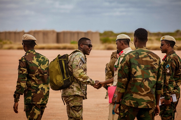 U.S. Army Capt. Darryl Padgett greets leaders of the Somali National Army (SNA) at Baledogle Military Airfield at the SNA-Danab graduation, Oct. 9, 2024. The joint efforts between the U.S. and Somalia, along with support from the international community, have been instrumental in enhancing the capabilities of the Somali’s military, enabling them to conduct effective counter-terrorism operations against al-Shabaab.