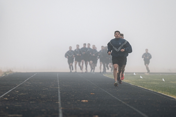 U.S. Airmen with the 66th Training Squadron’s Survival, Evasion, Resistance, Escape pre-team 25-02, participate in a two mile run during a physical training test at Fairchild Air Force Base, Wash., Oct. 29, 2024. The SERE career field is one of few that require a unique PT test alongside the standard Air Force PT test. The SERE test includes pull-ups, push-ups, sit-ups, a two mile run and a four mile ruck.  (U.S. Air Force photo by Senior Airman Tiffany Del Oso)
