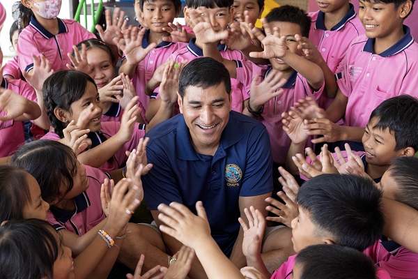 Lt. Cmdr. Jamil A. Khan, a chaplain at Military Sealift Command Far East, is greeted by children during a community outreach event at the Learning Center of the Human Help Network Foundation in Pattaya, Thailand, Nov. 7, 2024. (U.S. Navy photo by Grady T. Fontana)